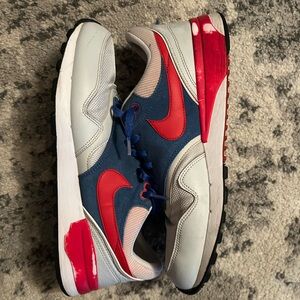 Men’s red and blue Nike sneakers